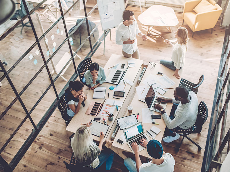 Staff around a meeting table