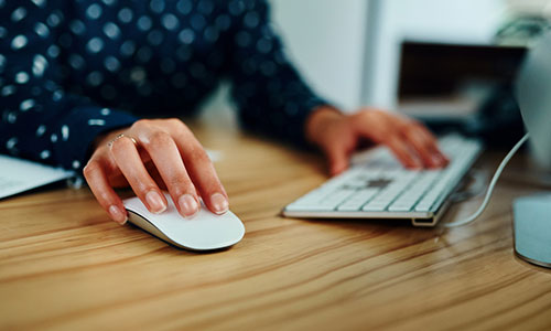 Woman using a computer mouse